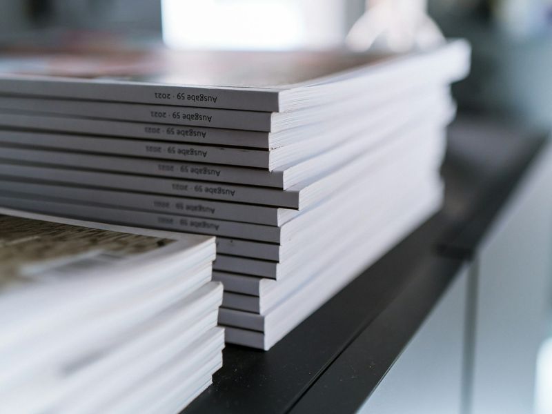 A stack of printed research publications