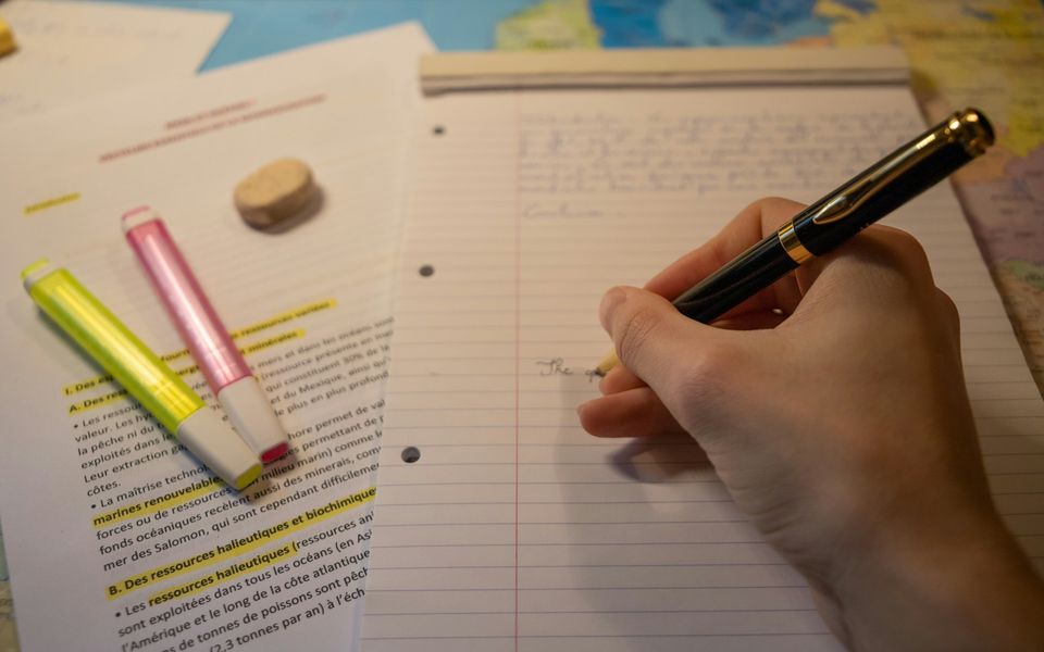 Annotated research notes with highlighter pens